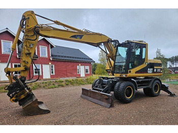 Wheel excavator Caterpillar M312 Engcon EC20 tiltrotator