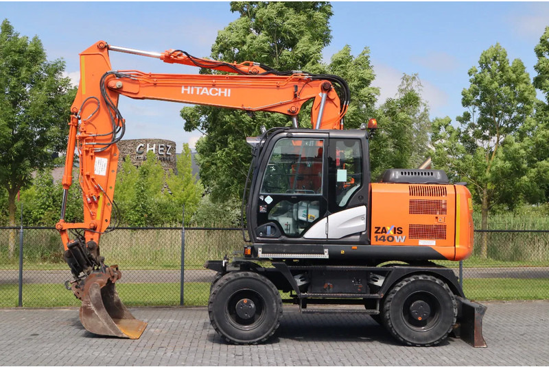 Hitachi ZX 140 W-5B | TILT QC | BUCKET | DOZER BLADE | DUTCH REG. - Wheel excavator: picture 1 Hitachi ZX 140 W-5B | TILT QC | BUCKET | DOZER BLADE | DUTCH REG. - Wheel excavator: picture 1