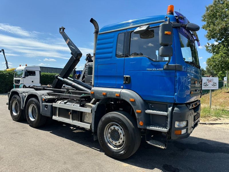 MAN TGA 33.400 6X4 HOOKLIFT AJK NHS20-4930mm - WB 3m60 - MANUAL ZF - STEEL SPRING / BLATT - BIG AXLES / AP ACHSEN - Hook lift truck: picture 1 MAN TGA 33.400 6X4 HOOKLIFT AJK NHS20-4930mm - WB 3m60 - MANUAL ZF - STEEL SPRING / BLATT - BIG AXLES / AP ACHSEN - Hook lift truck: picture 1