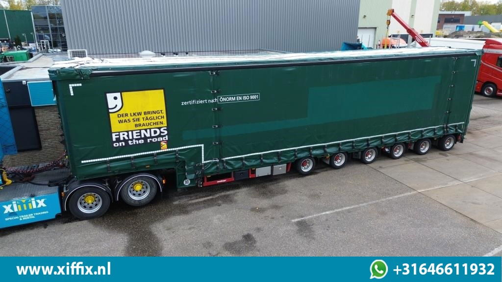 Meusburger 6-ass. Semi dieplader met elektische huifopbouw / 3x naloop gestuurd - Low loader semi-trailer: picture 1 Meusburger 6-ass. Semi dieplader met elektische huifopbouw / 3x naloop gestuurd - Low loader semi-trailer: picture 1