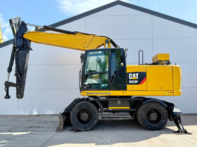 Cat M320F - Dutch Machine / Triple Boom / Auto Lube - Wheel excavator: picture 1 Cat M320F - Dutch Machine / Triple Boom / Auto Lube - Wheel excavator: picture 1