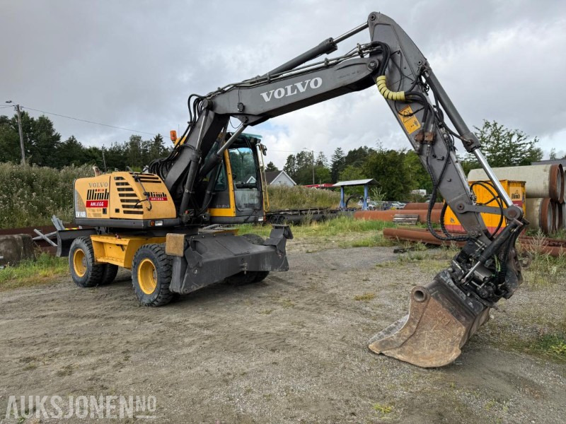 2006 Volvo EW140B Hjulgraver m/pallegaffel og skuff - Steelwrist tiltrotator. - Excavator: picture 2 2006 Volvo EW140B Hjulgraver m/pallegaffel og skuff - Steelwrist tiltrotator. - Excavator: picture 2