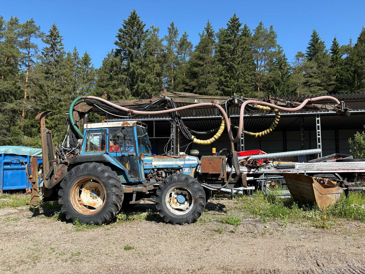 Rock drill Doofor DF530S and Tractor Ford New Holland 5610 - Drilling rig: picture 1 Rock drill Doofor DF530S and Tractor Ford New Holland 5610 - Drilling rig: picture 1