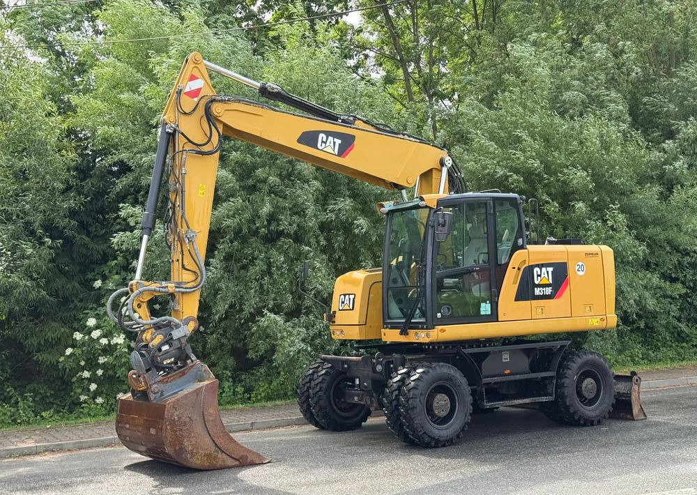 Caterpillar CAT 318 F * Powertilt * Sprowadzony* 9700 MTG * Caterpillar * Stan Perfekcyjny - Wheel excavator: picture 1 Caterpillar CAT 318 F * Powertilt * Sprowadzony* 9700 MTG * Caterpillar * Stan Perfekcyjny - Wheel excavator: picture 1