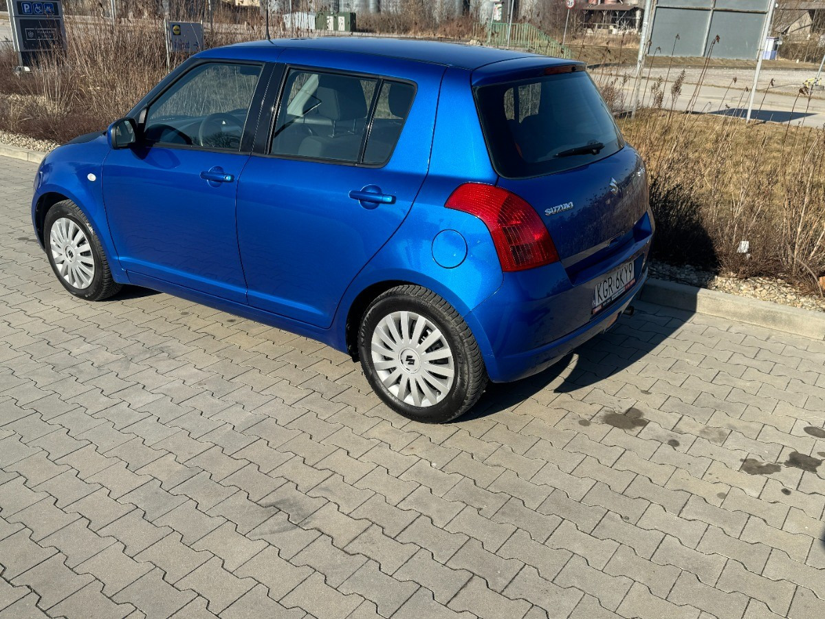 Suzuki Swift 1.3 benzyna 90km Klimatyzacja 136tys przebieg Auto prywatne zadbane - Car: picture 4 Suzuki Swift 1.3 benzyna 90km Klimatyzacja 136tys przebieg Auto prywatne zadbane - Car: picture 4