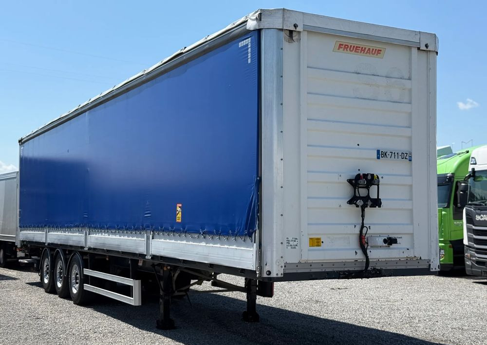 Fruehauf OSIE SAF BURTO FIRANKA PODNOSZONA OŚ - Curtainsider semi-trailer: picture 1 Fruehauf OSIE SAF BURTO FIRANKA PODNOSZONA OŚ - Curtainsider semi-trailer: picture 1