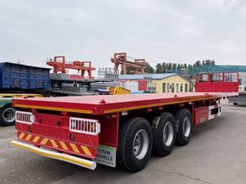 TITAN Flatbed Tri Axle Truck Trailer for Sale in Tanzania - Dropside/ Flatbed semi-trailer: picture 2 TITAN Flatbed Tri Axle Truck Trailer for Sale in Tanzania - Dropside/ Flatbed semi-trailer: picture 2