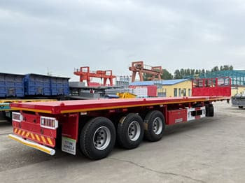 TITAN Flatbed Tri Axle Truck Trailer for Sale in Tanzania - Dropside/ Flatbed semi-trailer: picture 3 TITAN Flatbed Tri Axle Truck Trailer for Sale in Tanzania - Dropside/ Flatbed semi-trailer: picture 3